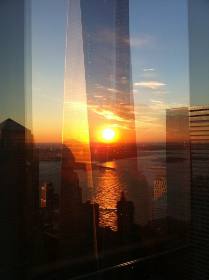 was kind of a triple reflection. The sun was bouncing off the windows of the building I was in, back at me, then again from 1WTC. The reflection of the river was actually on the inside of the windows of the building I was in (4WTC).