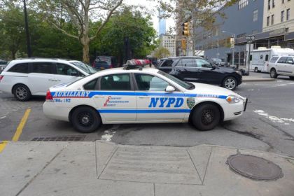 NYPD car parked in Ericsson crosswalk