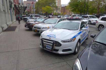 NYPD cars taking half of Ericsson sidewalk