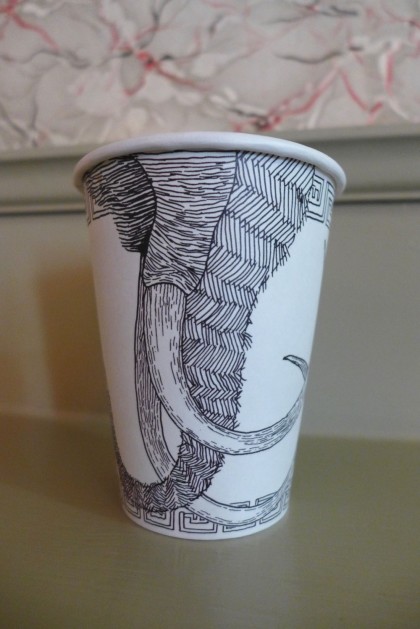 The Wooly Daily back of cup
