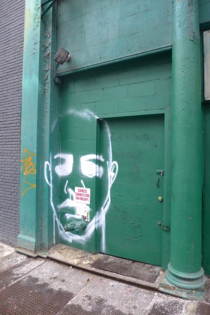 street art face on Walker 20915