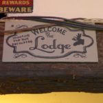 Raccoon Lodge: "Welcome to the Lodge" sign.