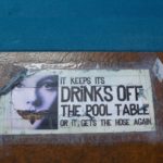 Raccoon Lodge pool table warning.