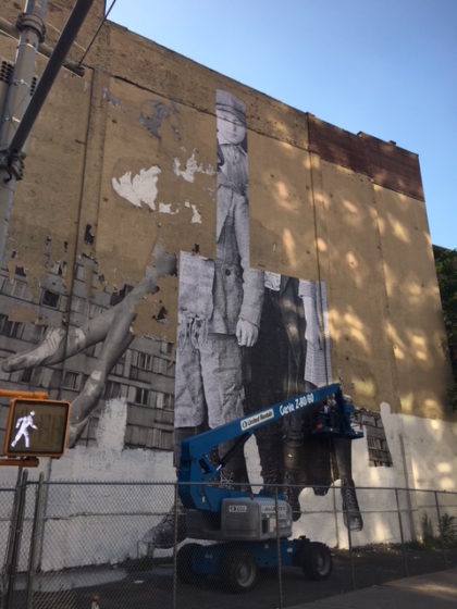 JR mural in progress at 100 Franklin