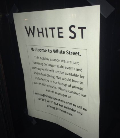 white-street-restaurant-sign